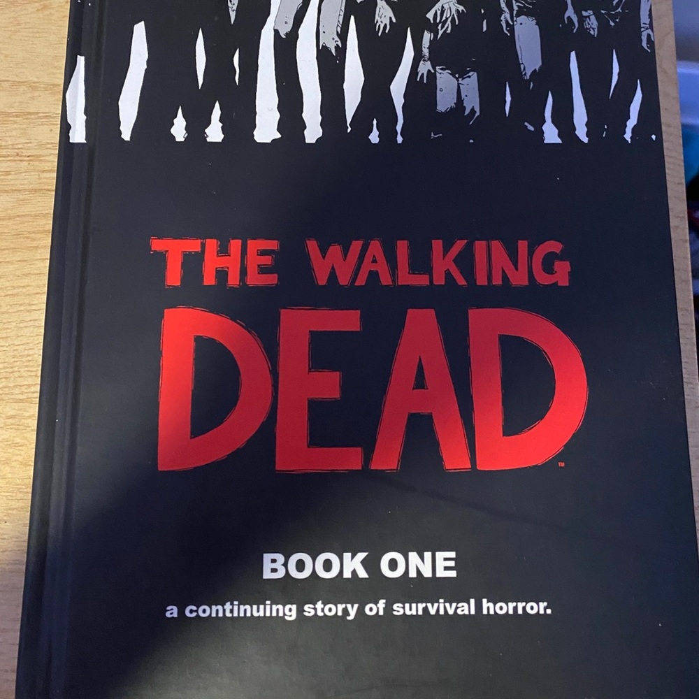Walking dead hard cover book one graphic novel.